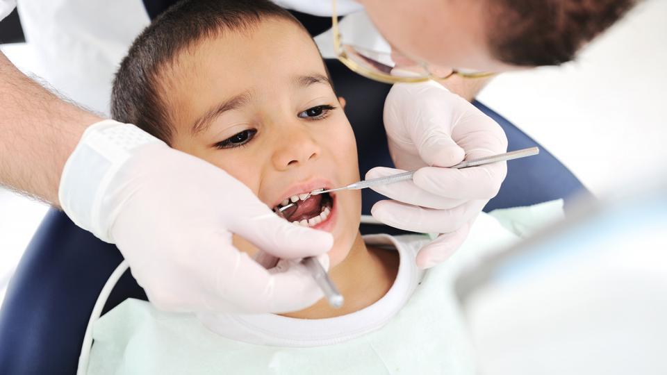 young boy getting a dental exam