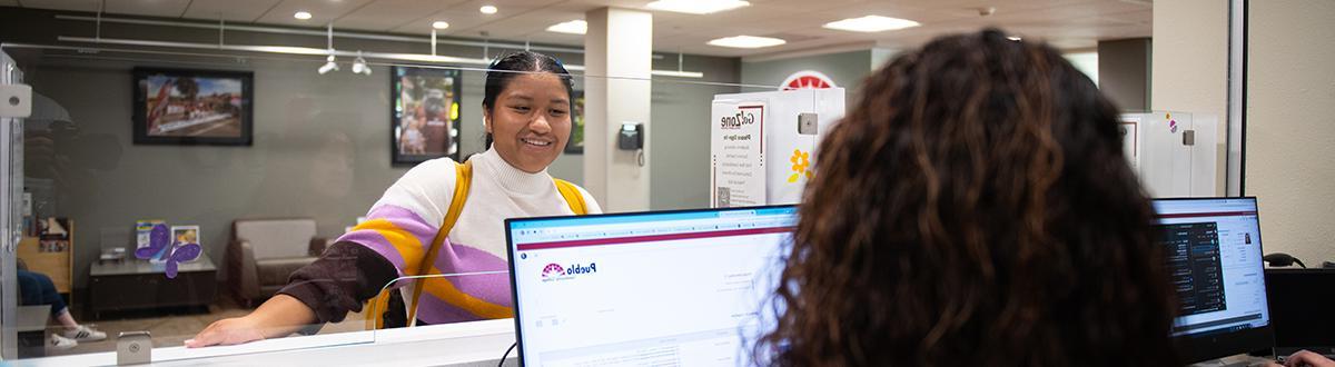 Student at Welcome Center desk